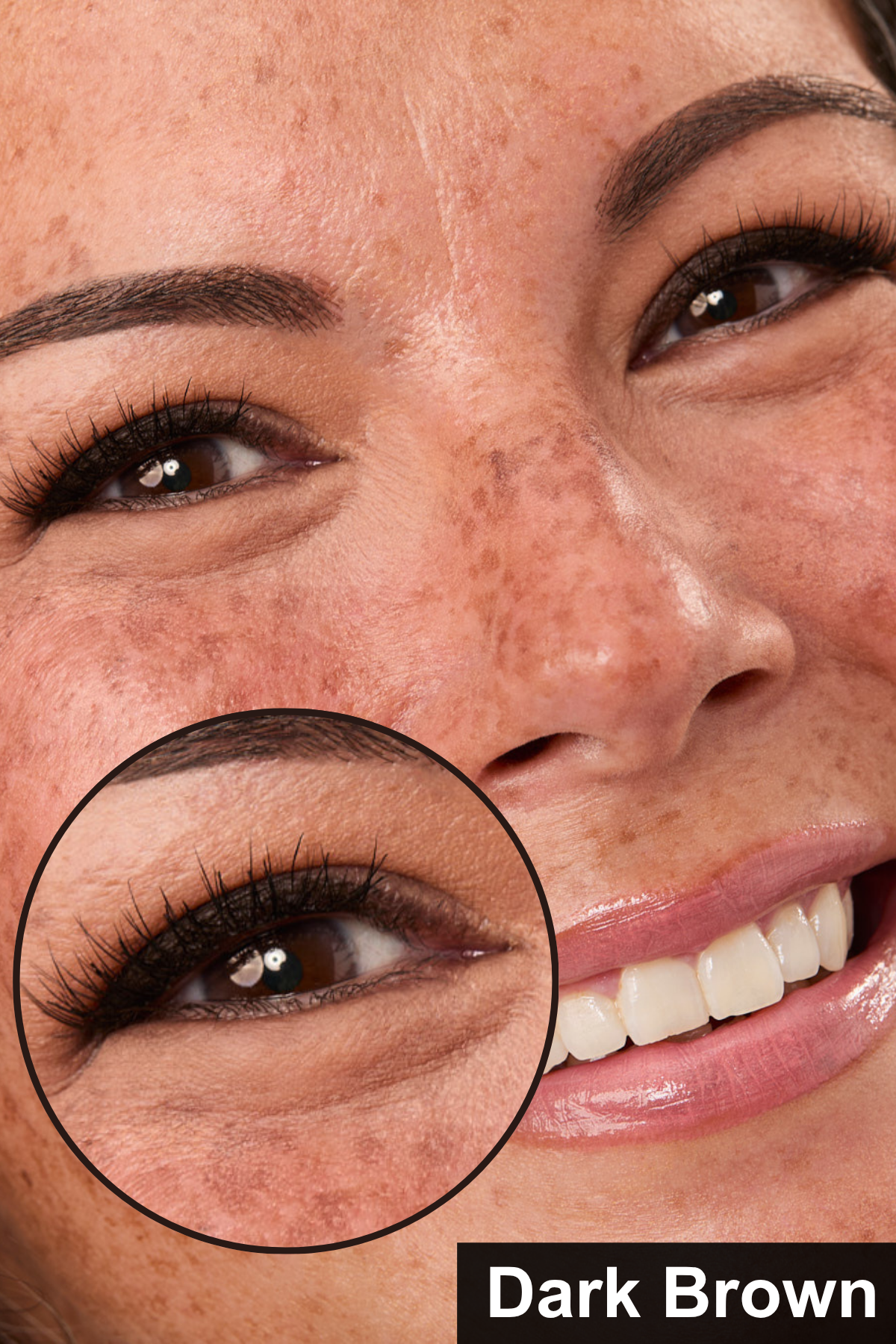 Close-up of a woman's face with a focus on her eye, showing dark brown color.