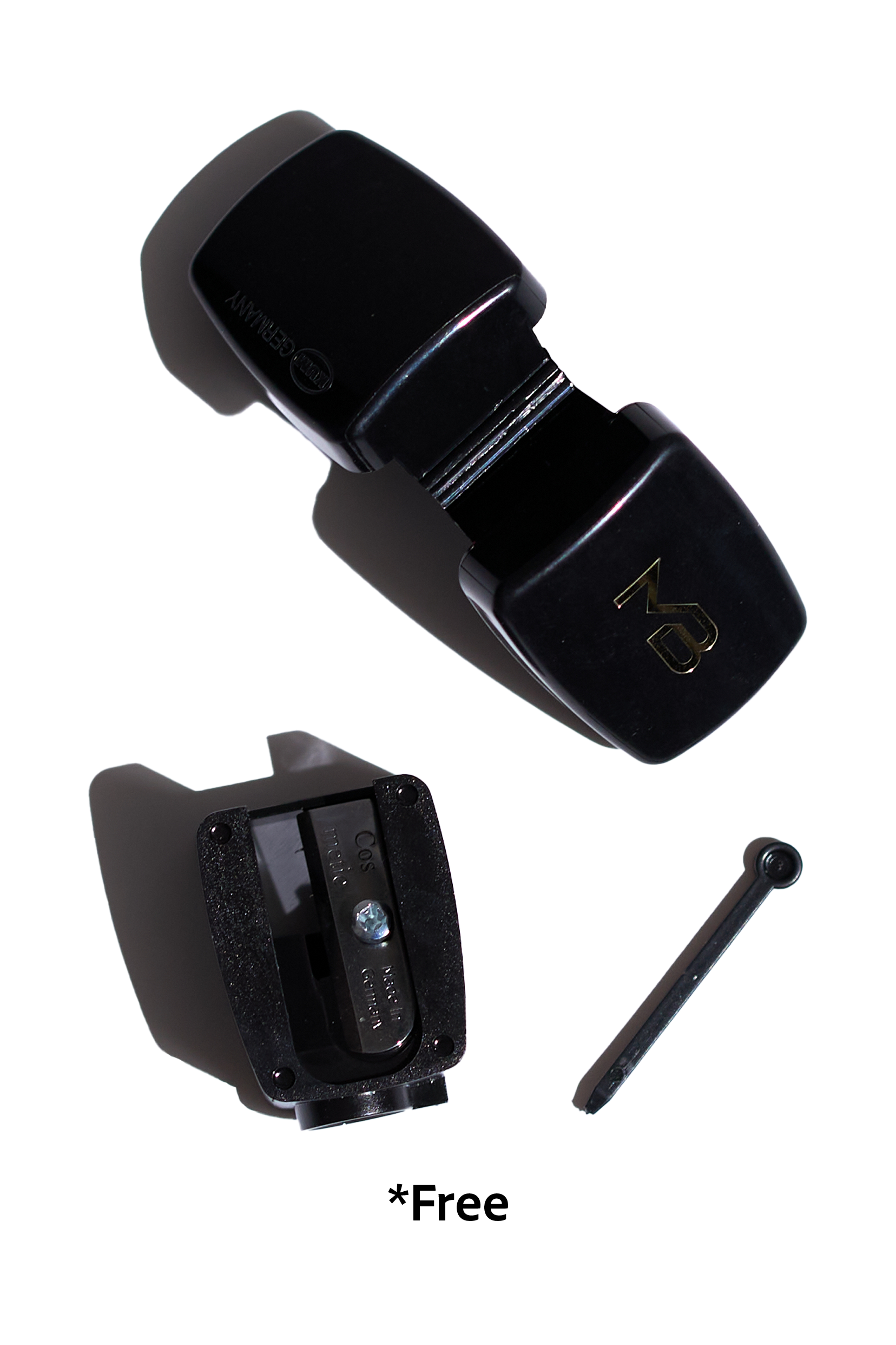 Black pencil sharpener disassembled with the word free under it.