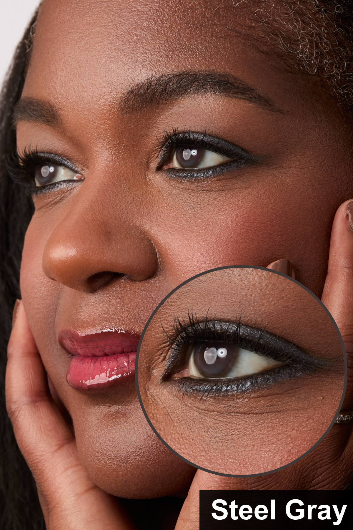 Steel Gray Eyeliner applied on a woman with a close up of her eye .