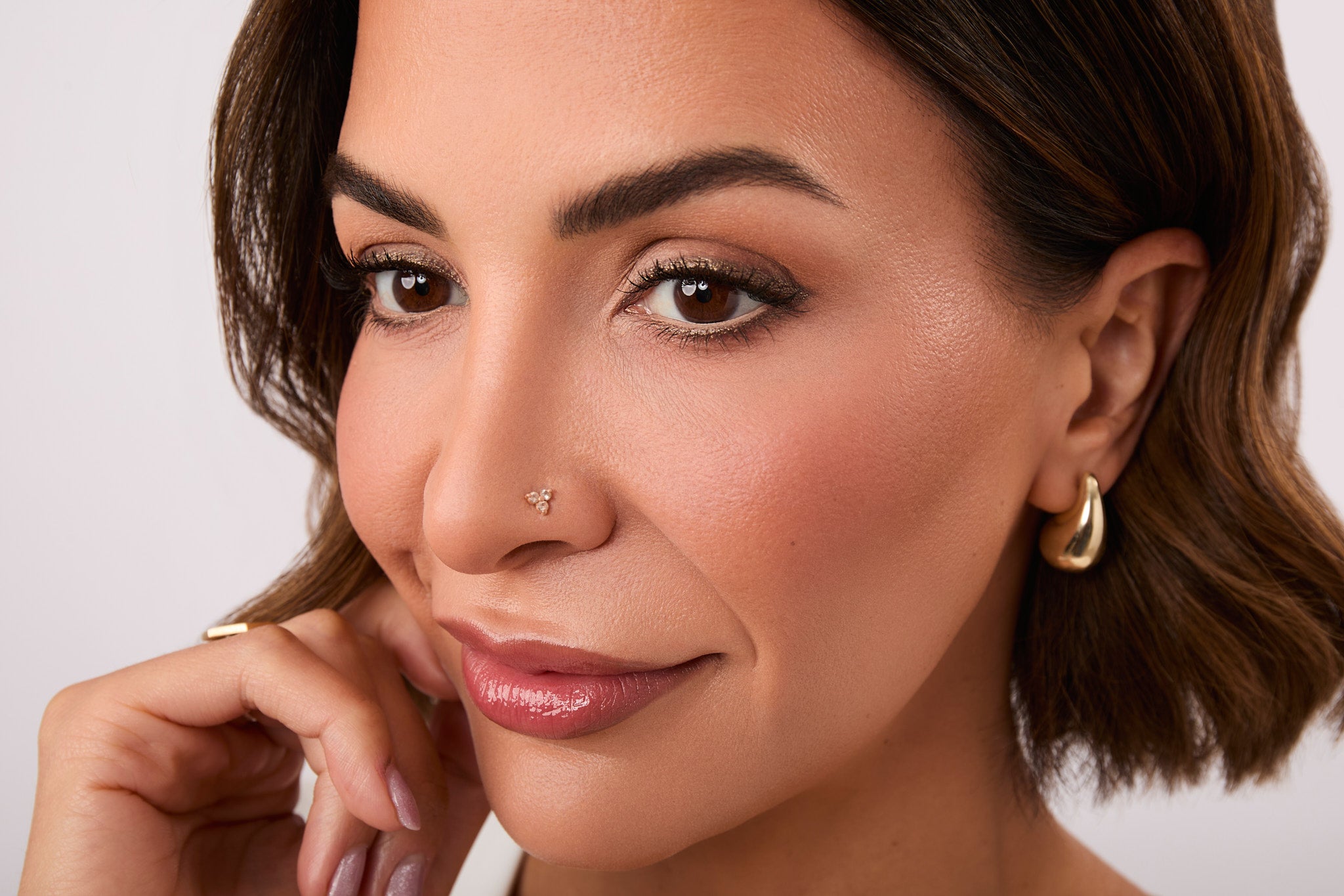 Close up of Glam Girl Gabi wearing Champagne Bronze Eyeliner.
