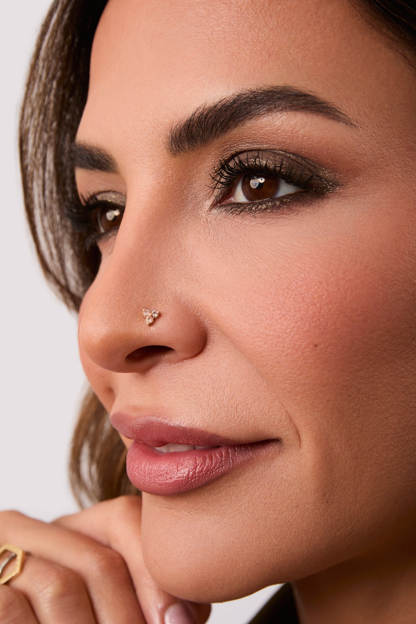 Gabi's face close up with the Champagne Bronze Eyeliner Applied.